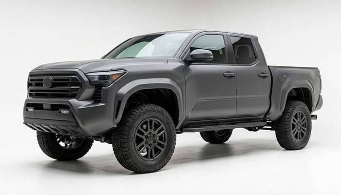 Lifted pickup truck on 17x9 wheels with all-terrain tires showing fender clearance and stance