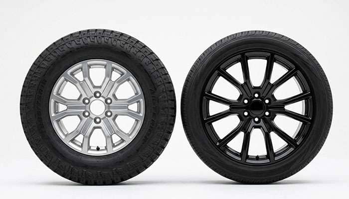 Side-by-side comparison of an 18-inch and a 22-inch pickup wheel and tire