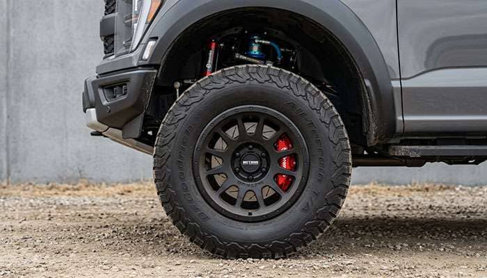 20 inch off-road wheel mounted on a lifted desert runner truck with aggressive all-terrain tire showing the modern styling typical of prerunner and street biased off road builds