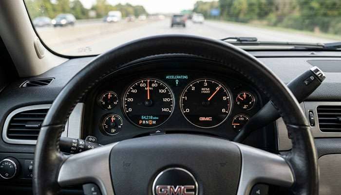 2012 GMC Yukon dashboard showing acceleration with a heavy feeling on the vehicle's performance gage.