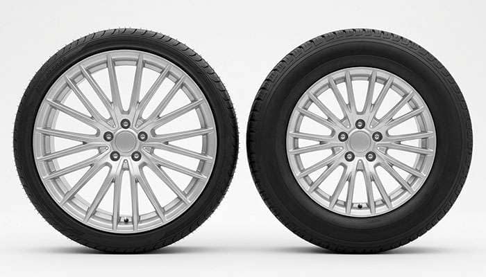 Side by side comparison of a low profile 21 inch tire sidewall and a taller sidewall tire