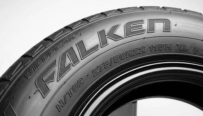 Close-up of a Falken Wildpeak H/T02 275/50R22 tire sidewall showing the 115H XL load index marking