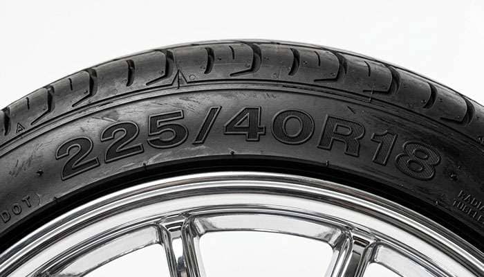 Close-up of a low profile tire sidewall showing the short 3.5 inch distance between the wheel rim and the tread