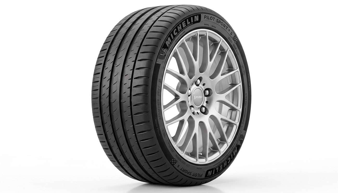 A 225/45R18 ultra high performance tire mounted on a silver alloy wheel on a clean white seamless backdrop