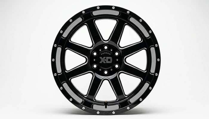 Face view of a wide 22x12 aftermarket truck wheel showing the deep concave spoke profile