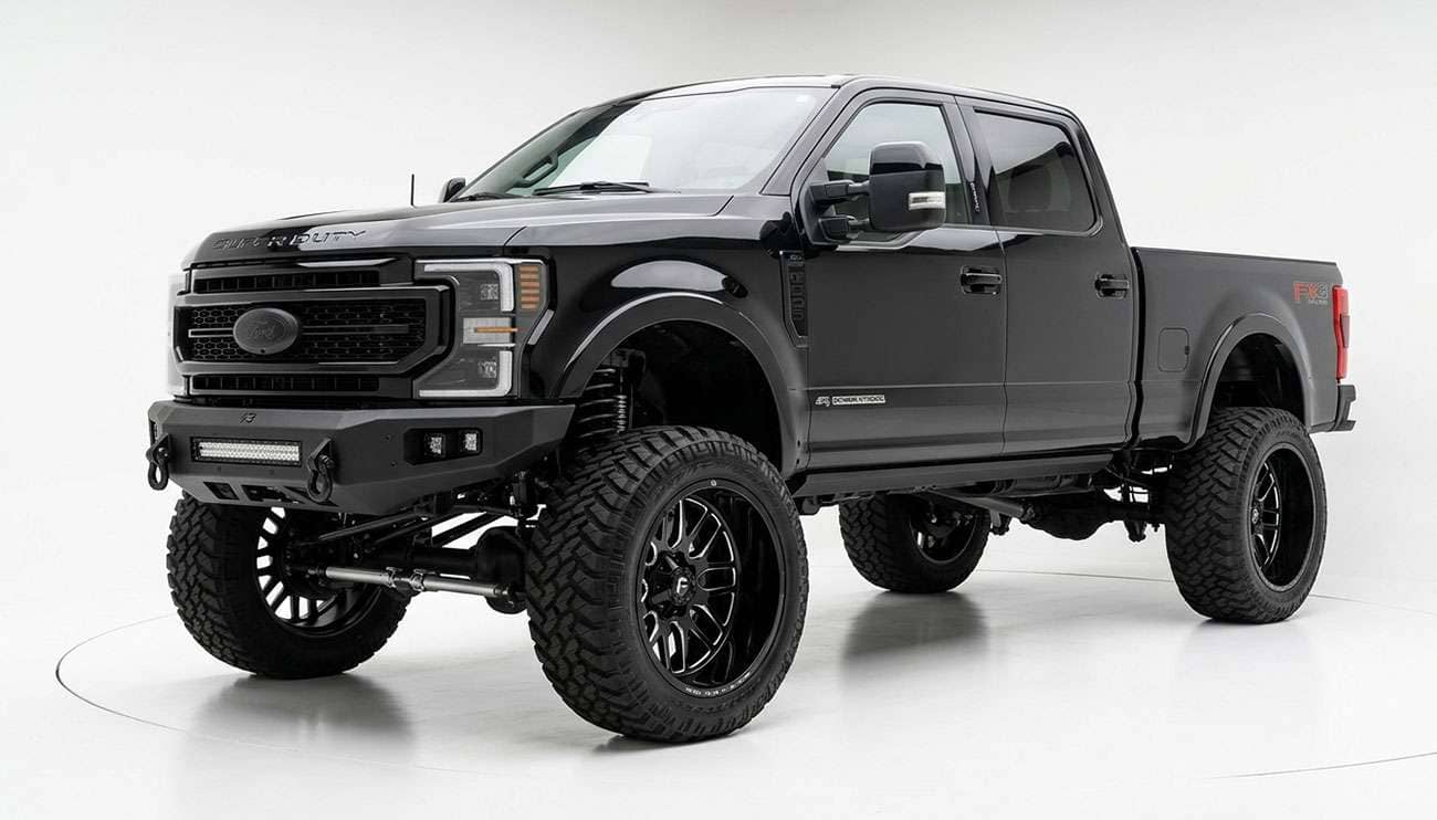 Lifted full-size pickup truck on wide 22x12 aftermarket wheels with negative offset
