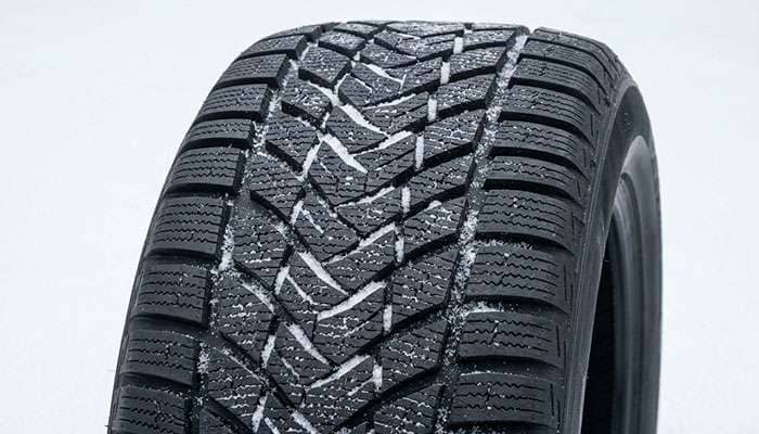 Winter 235/45R17 tire with dense siping and directional snow tread pattern
