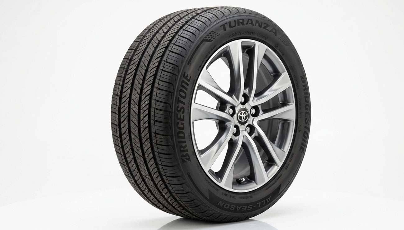 A 235/55R18 all-season tire mounted on a crossover alloy wheel on a clean white studio background