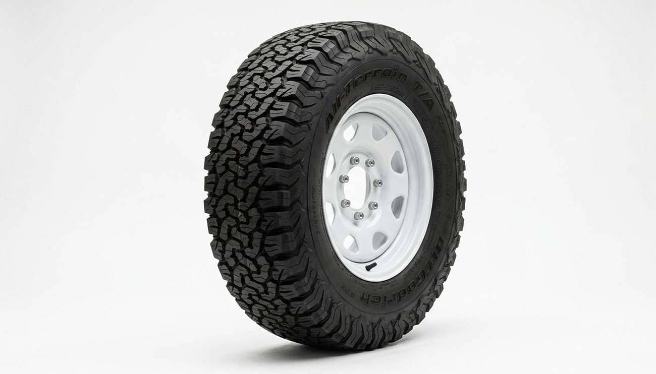LT235/85R16 all-terrain light truck tire mounted on a 16 inch steel wheel on a clean white backdrop