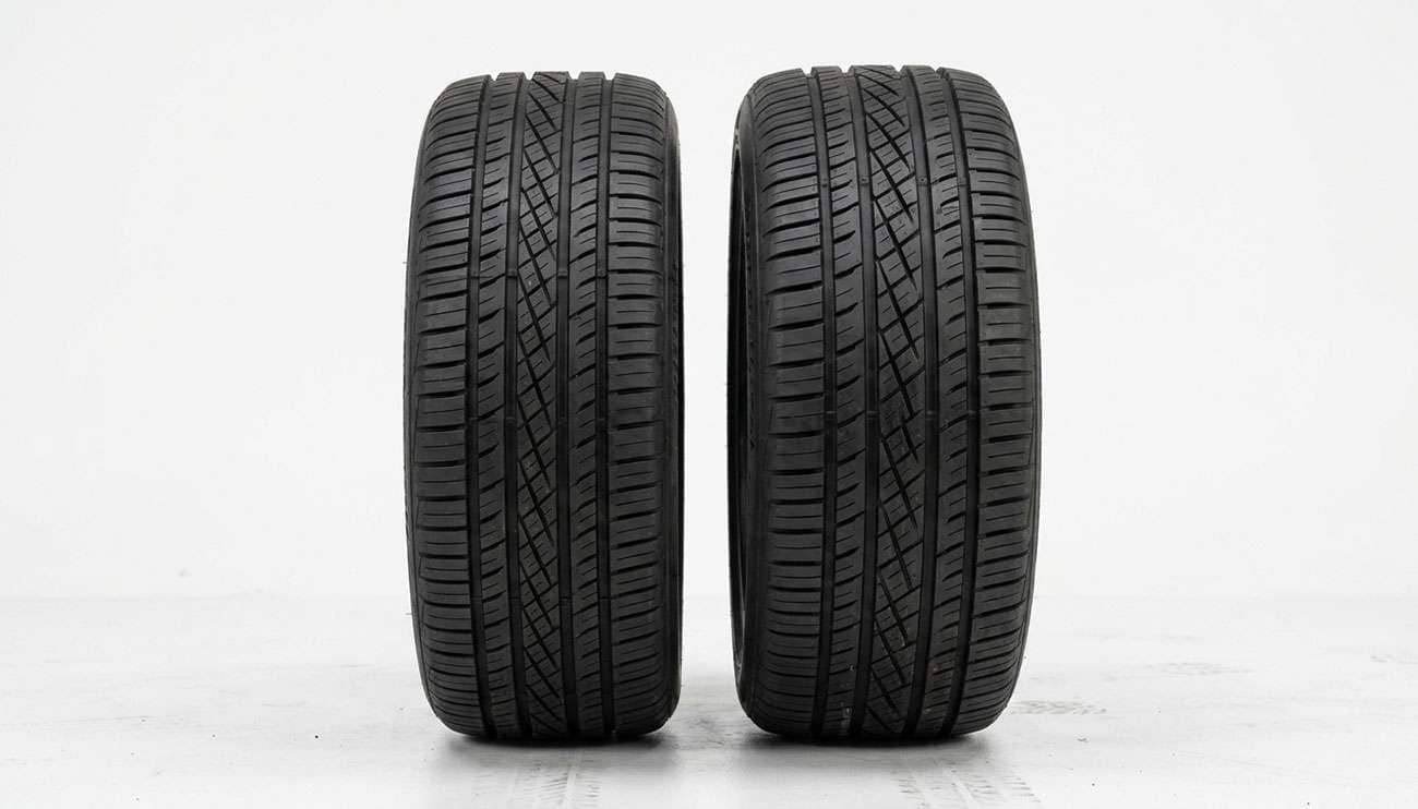 A 235 tire and a 225 tire shown side by side for width comparison on a white studio backdrop
