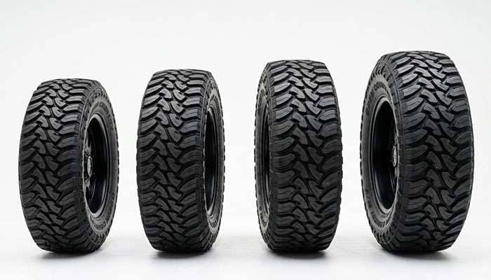 Row of oversized 24 inch off-road tires arranged from shortest to tallest showing the range of available sizes