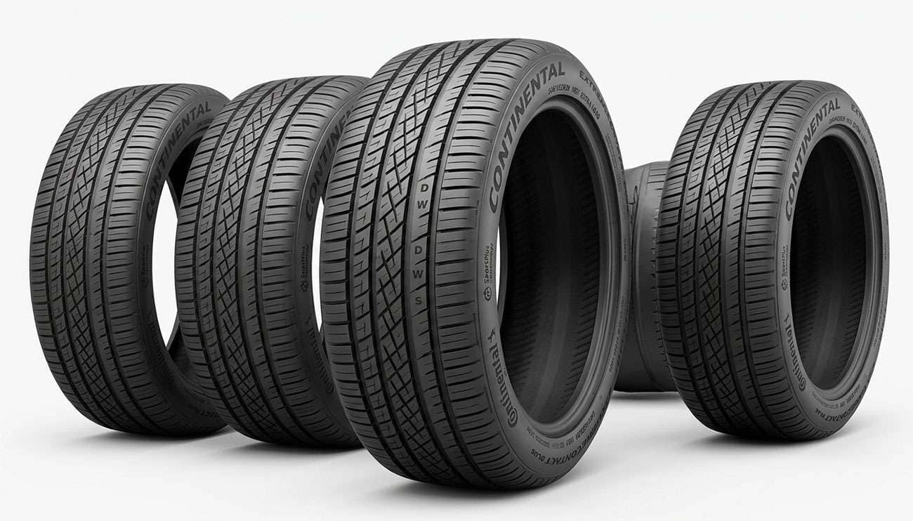 Set of 245/45R20 performance all-season tires arranged on a shop floor showing tread patterns and sidewall markings