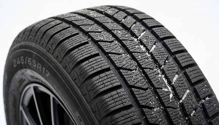 Winter tire tread with dense siping and deep grooves for severe snow traction