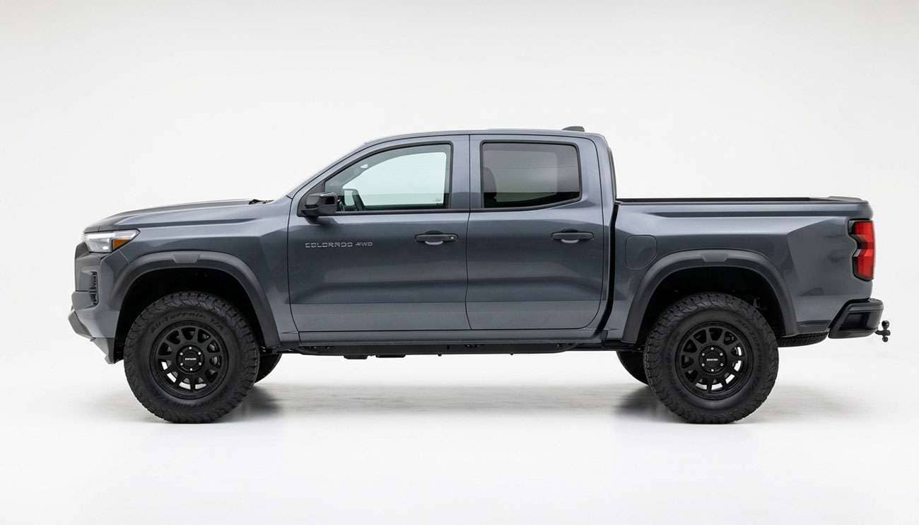 Mid-size pickup truck fitted with 265 65R17 all-terrain tires shown in full side profile