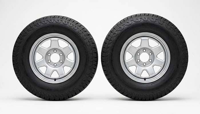 Side by side comparison of a 265/60R18 tire and a taller 265/65R18 tire showing the difference in sidewall height
