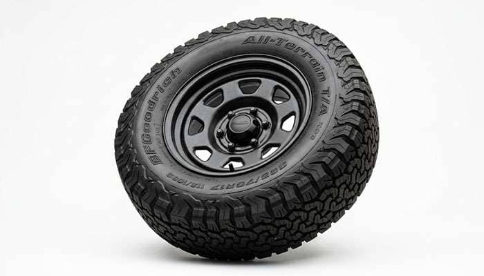 265/70R17 tire mounted on a 17x7.5 steel wheel showing the sidewall bulging slightly past the rim flange