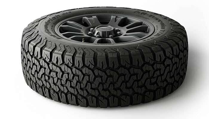 Close-up of an all-terrain truck tire tread pattern mounted on an 18-inch wheel