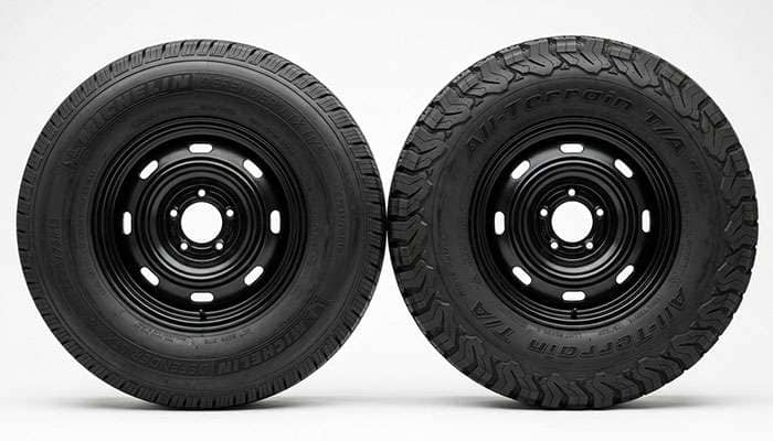 Two truck tire sidewalls side by side showing light truck and passenger metric size markings