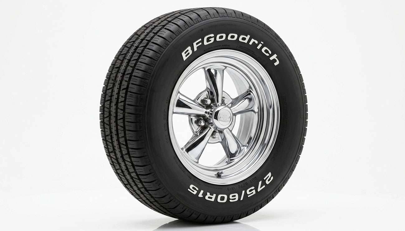 275/60R15 raised-white-letter performance radial tire mounted on a 15-inch muscle car wheel on a clean white seamless studio backdrop
