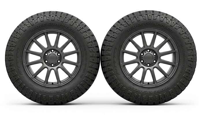 Side-by-side comparison of a 295/65R20 tire and a 35x12.50R20 tire showing the difference in tread width