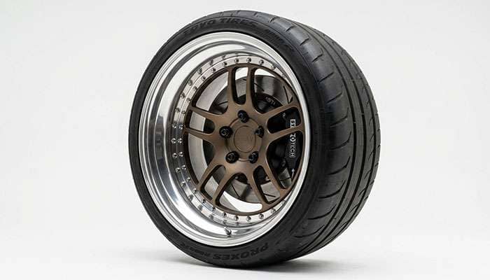 Deep-lip 3-piece wheel mounted on a vehicle showing how lip depth affects how the wheel sits in the fender