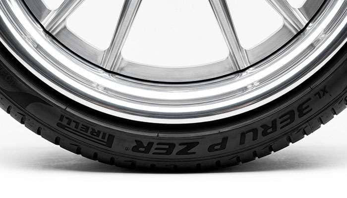 Close-up of a low profile tire sidewall mounted on a 30 inch wheel showing minimal sidewall height