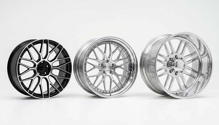 Three 30 inch wheels of different widths standing side by side showing lip depth differences