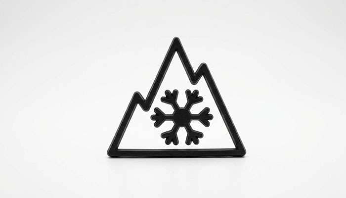 3PMSF winter tire symbol featuring a snowflake inside a mountain outline on a blue gradient background
