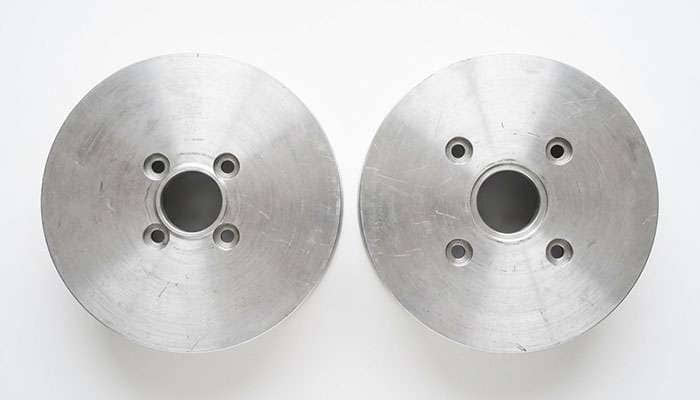 Two four lug bolt patterns overlaid to show how far the stud positions diverge between a 100 millimeter and a 108 millimeter circle