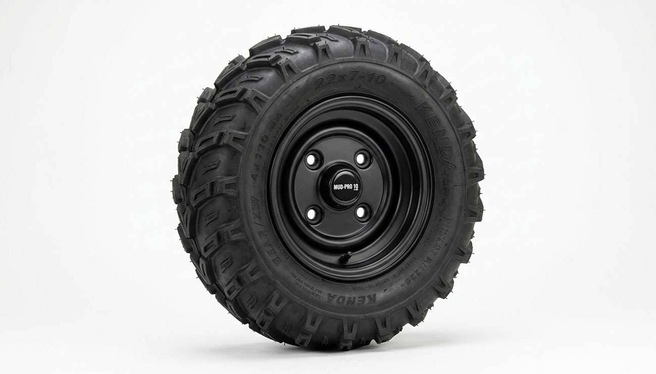 4x110 bolt pattern ATV wheel with four lug holes and a knobby off-road tire