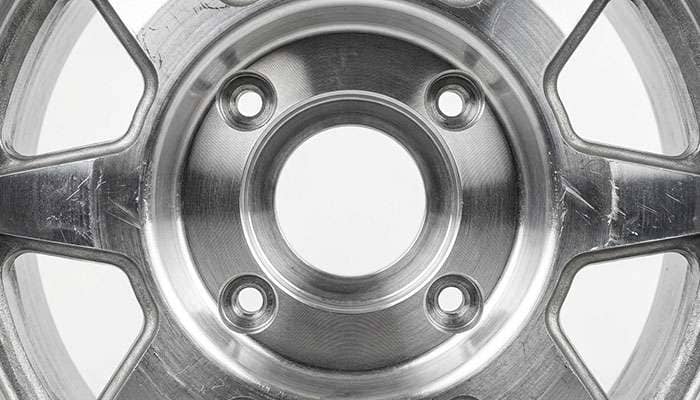 Close-up of the center bore of a UTV wheel showing the machined register that seats on the hub