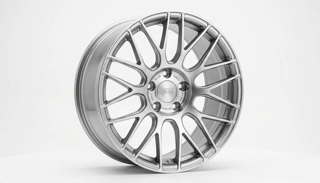 Silver five-lug performance wheel with a 5x130 bolt pattern on a clean white studio backdrop