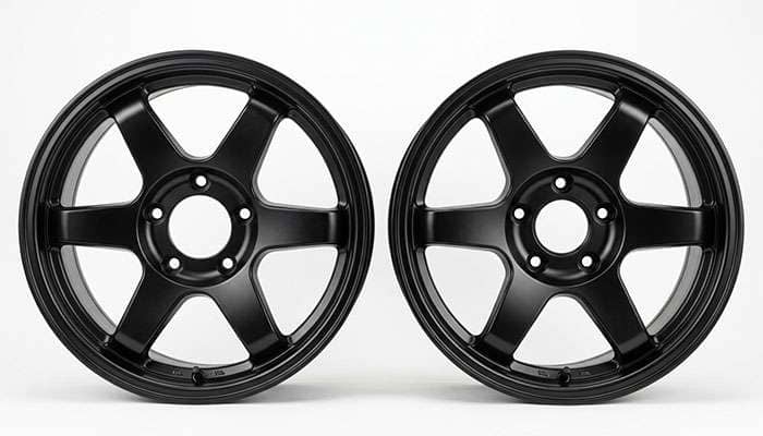 Side by side comparison of a five lug 5x150 wheel face and a five lug 5x139.7 wheel face showing the difference in bolt circle diameter