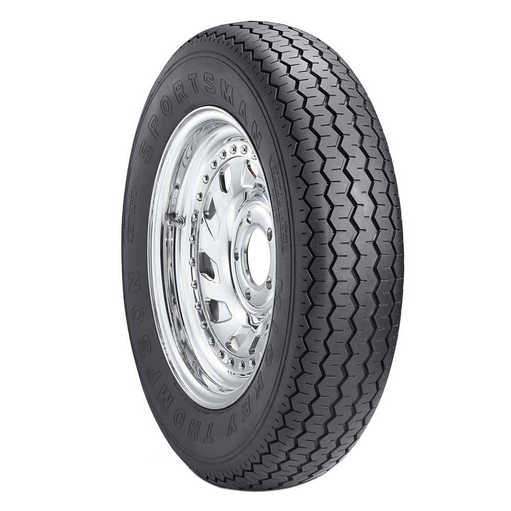 Mickey Thompson Sportsman Front skinny front runner tire for a pro street car on a clean white studio backdrop