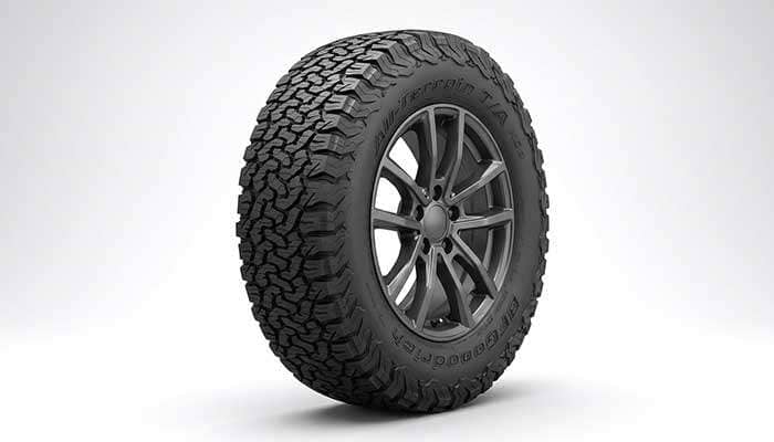 All-terrain tire with aggressive tread pattern on SUV wheel
