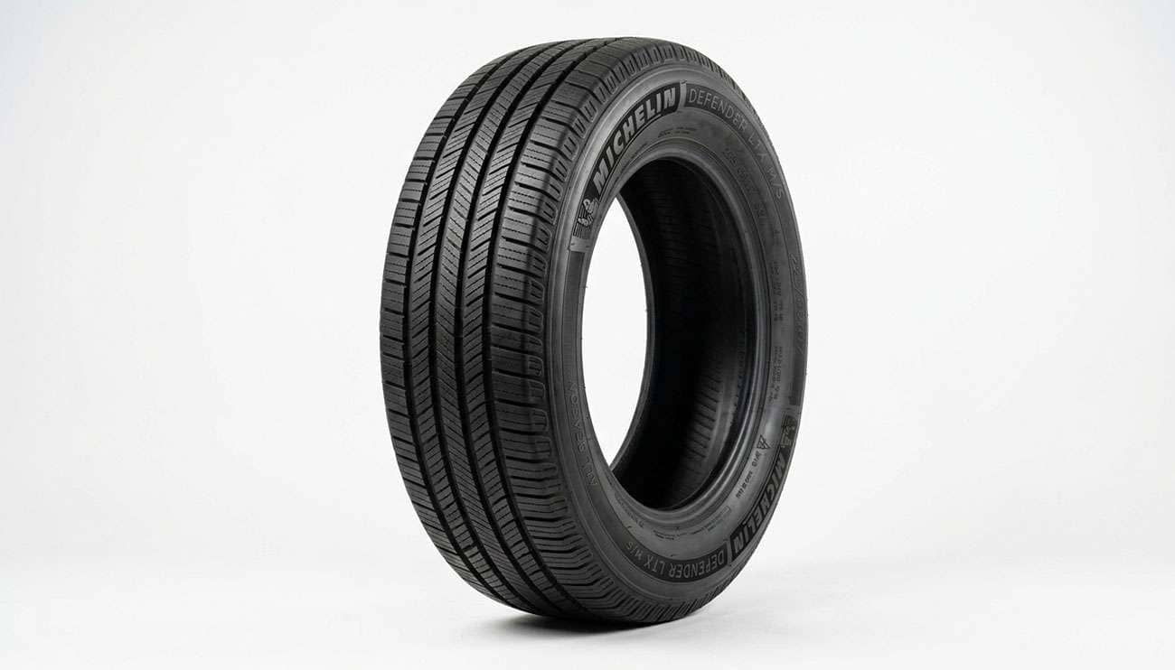 American-made tire displayed on a clean white seamless studio backdrop representing tires manufactured in the USA