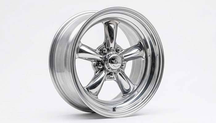 American Racing forged five-spoke muscle car wheel on a white studio backdrop