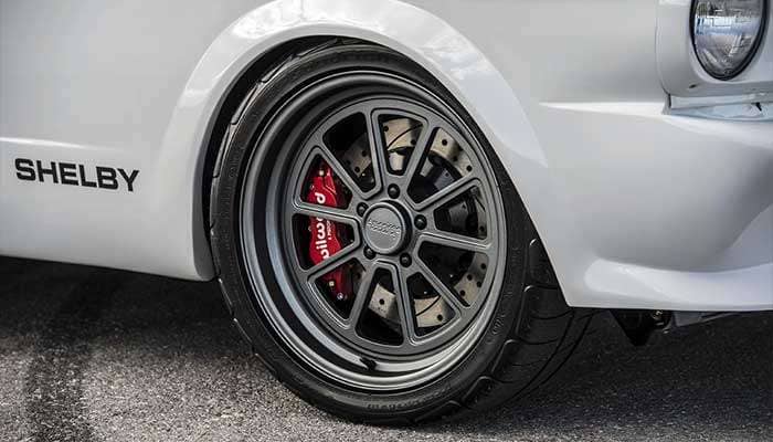 American Racing classic Torq Thrust wheel showcasing iconic five-spoke design and polished finish