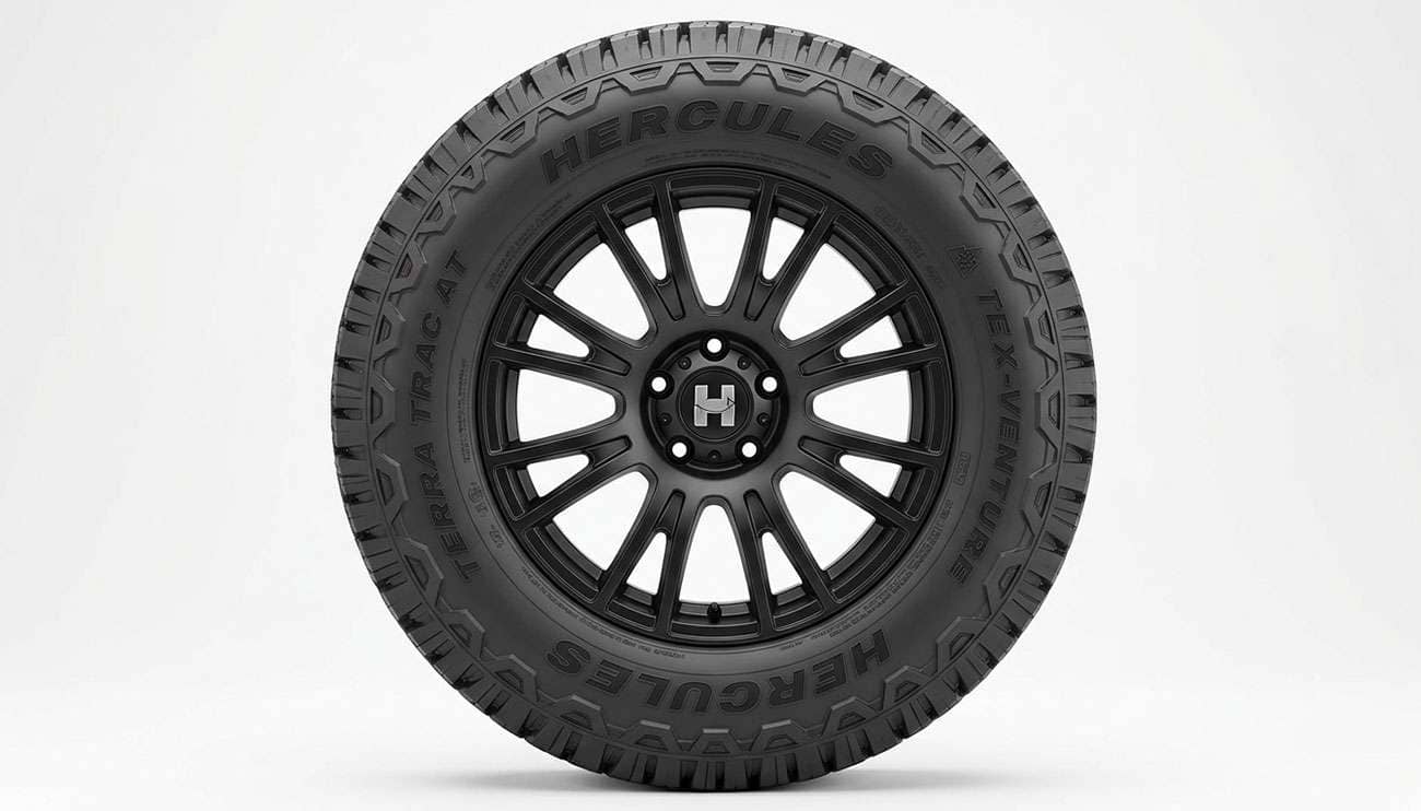 Hercules Terra Trac AT X-Venture all-terrain tire with aggressive tread mounted on a matte black alloy wheel