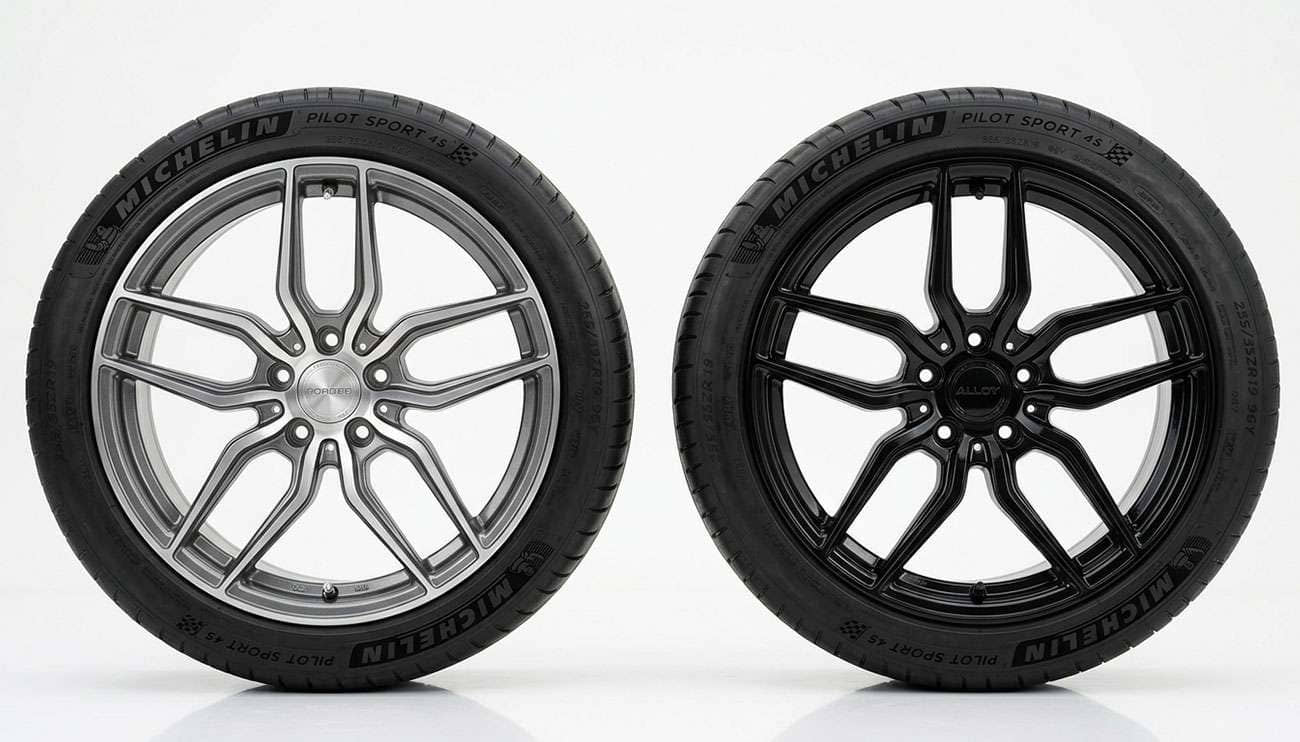Silver machined alloy wheel and gloss black alloy wheel displayed side by side