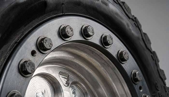 Macro close-up of beadlock ring with hardware showing the bolt pattern