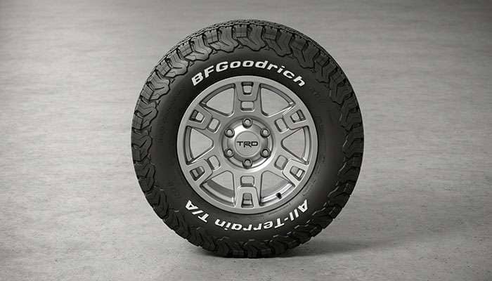 BFGoodrich All-Terrain T/A tire mounted on a silver TRD alloy wheel displayed on concrete ground