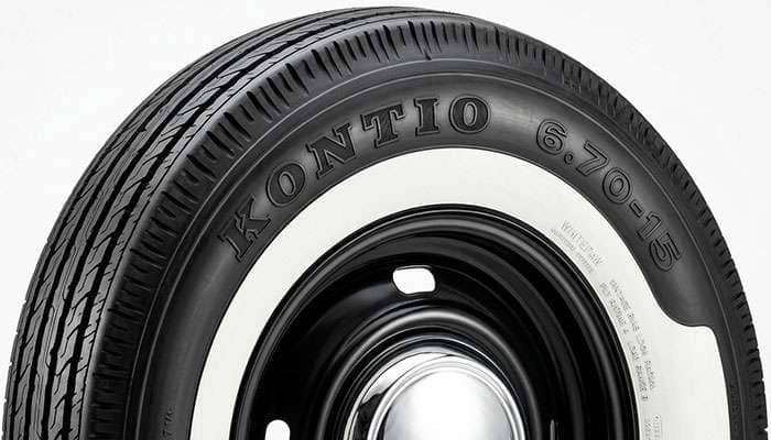 Close-up of a Kontio WhitePaw Vintage Bias Look Radial whitewall sidewall showing inch-style 6.70-15 size marking and period lettering