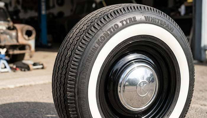 Close-up of a Kontio Tyre WhitePaw Vintage Bias Look Radial whitewall sidewall showing the tall rounded profile