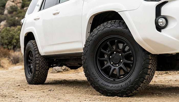 Black Rhino Overland black alloy wheel with BFGoodrich All-Terrain T/A tire mounted on a white vehicle