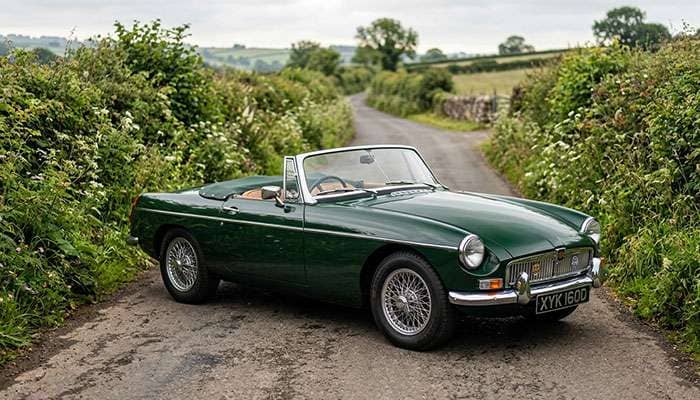 British classic roadster on a country road fitted with period-style radial tires