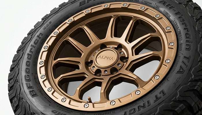 Bronze satin off-road wheel finish close-up on an aggressive spoke design, studio view