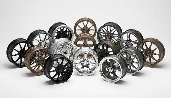 Various car wheel rims displayed alongside performance tips on weight, design, weather use, and drive system compatibility