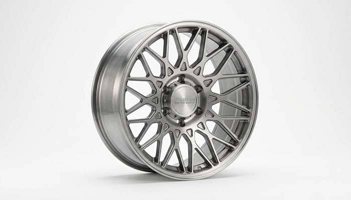 Cast aluminum truck rim with intricate spoke design and stylish finish