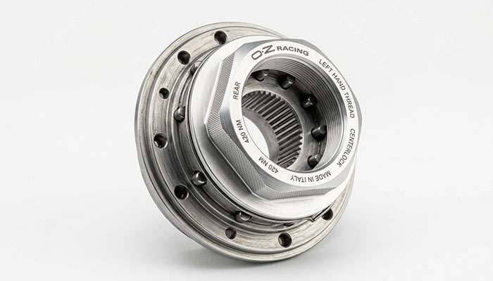 Close-up of a single centerlock nut on a splined hub with drive pins